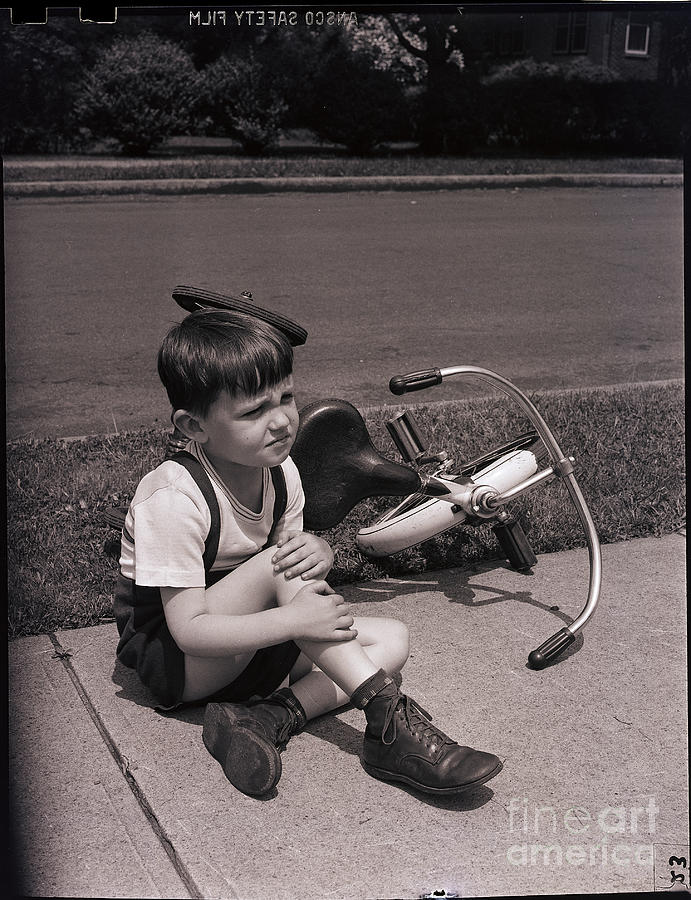 Boy Who Has Fallen Off Bicycle Photograph by Bettmann