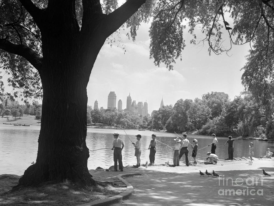 Boys Fishing In Central Park Photograph by Bettmann