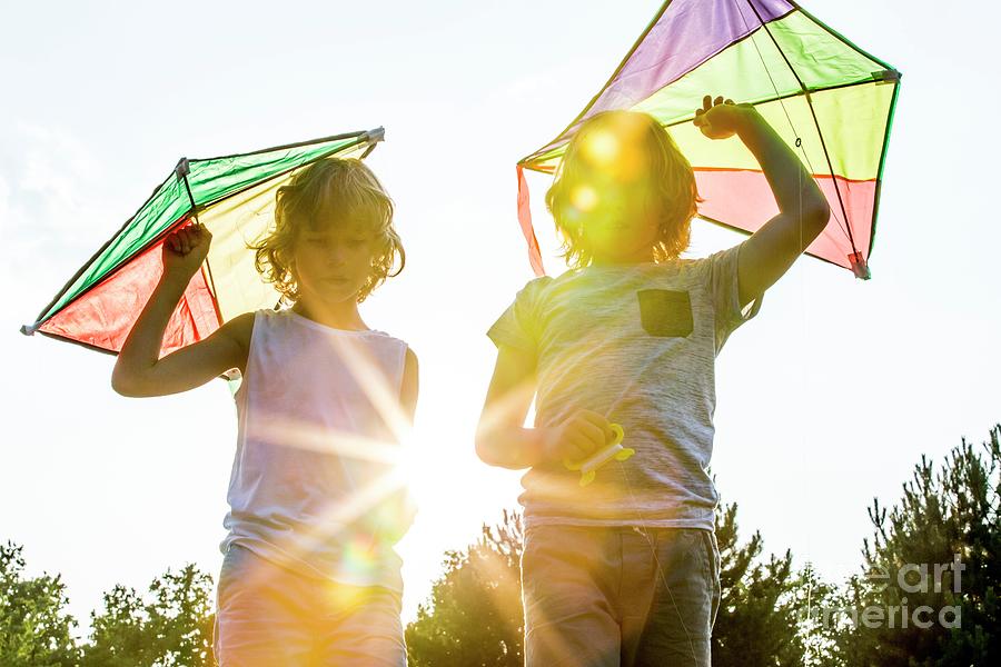 Boys Holding Kite by Science Photo Library