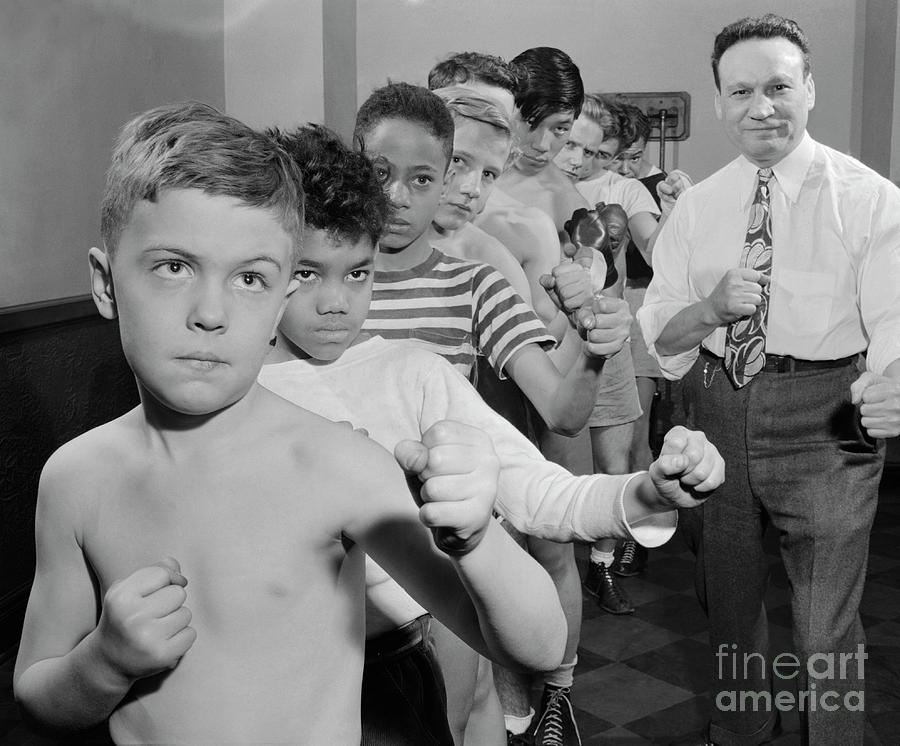 Boys Practicing Punches As Coach Watches Photograph by Bettmann