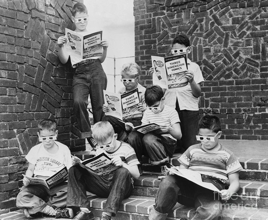 Boys Reading Comic Books Photograph by Bettmann