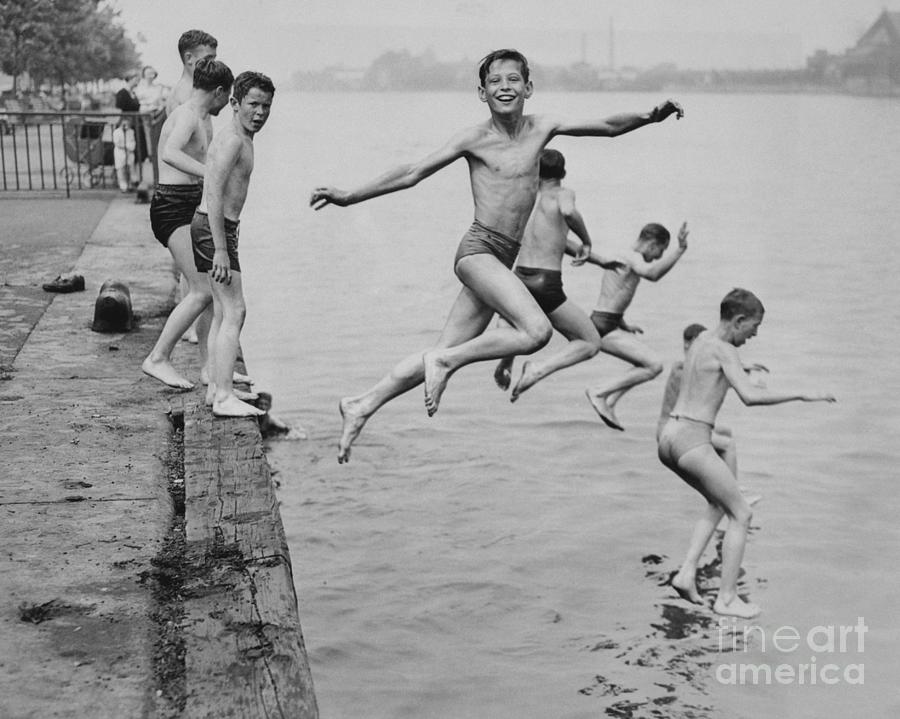 Boys While Diving From East River Dock Photograph by Bettmann