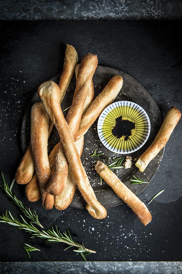 Braedsticks With Herbs, Olive Oil And Balsamic Vinegar seen From Above Photograph by Magdalena Hendey