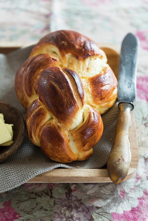 Braided Yeast Loaf With Butter Photograph by Veronika Studer