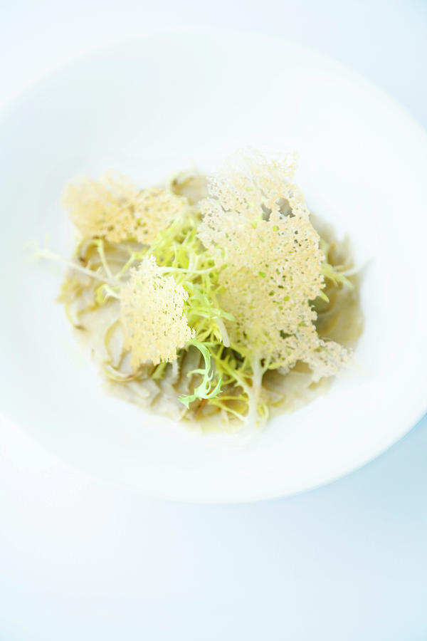Braised Breton Artichoke With Frise Lettuce And Parmesan Chips Photograph by Michael Wissing