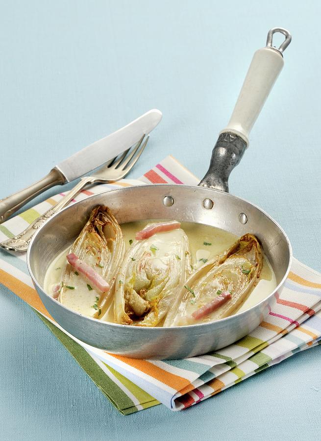 Braised Chicory In A White Wine Sauce Photograph by Franco Pizzochero