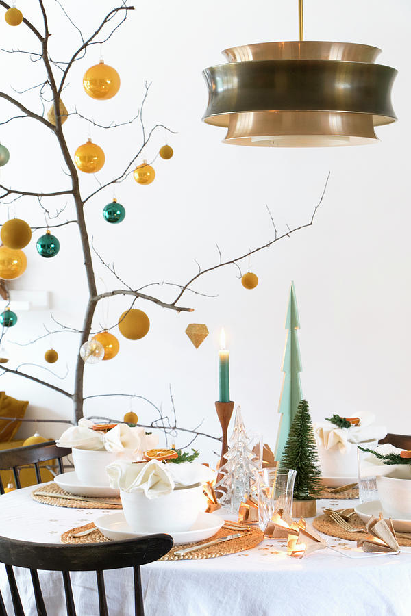 Branch Decorated With Yellow And Petrol Baubles On Set Table Photograph by Marij Hessel