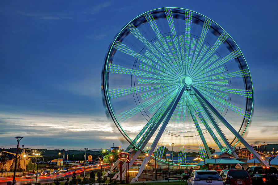 Branson Strip and Ferris Wheel at Dusk Photograph by Gregory Ballos