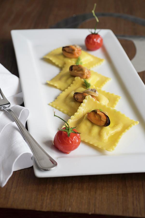 Branzini Ravioli With Mussels And Braised Tomatoes Photograph by Jalag / Francesca Moscheni