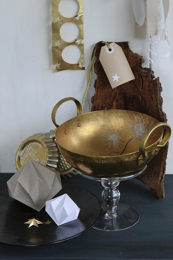 Brass Bowl On Glass Cake Stand Next To Origami Gemstone Shapes Photograph by Regina Hippel