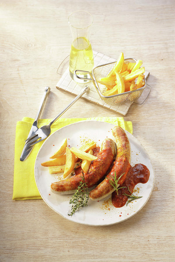 Bratwurst With Chips Photograph by Uwe Bender