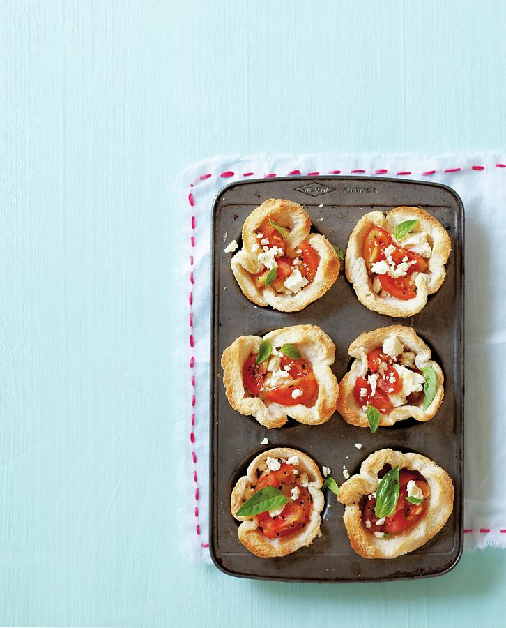 Bread Bowls With Tomato And Feta Cheese In A Muffin Tin Photograph by Great Stock!