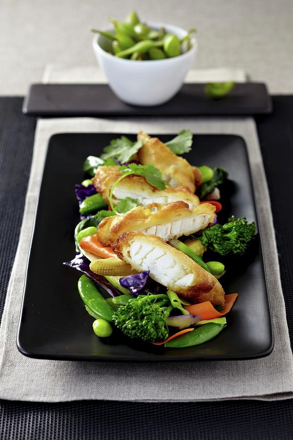 Bread Cod Fillet With Edamame Beans, Broccoli And Red Cabbage asia Photograph by Alessandra Pizzi
