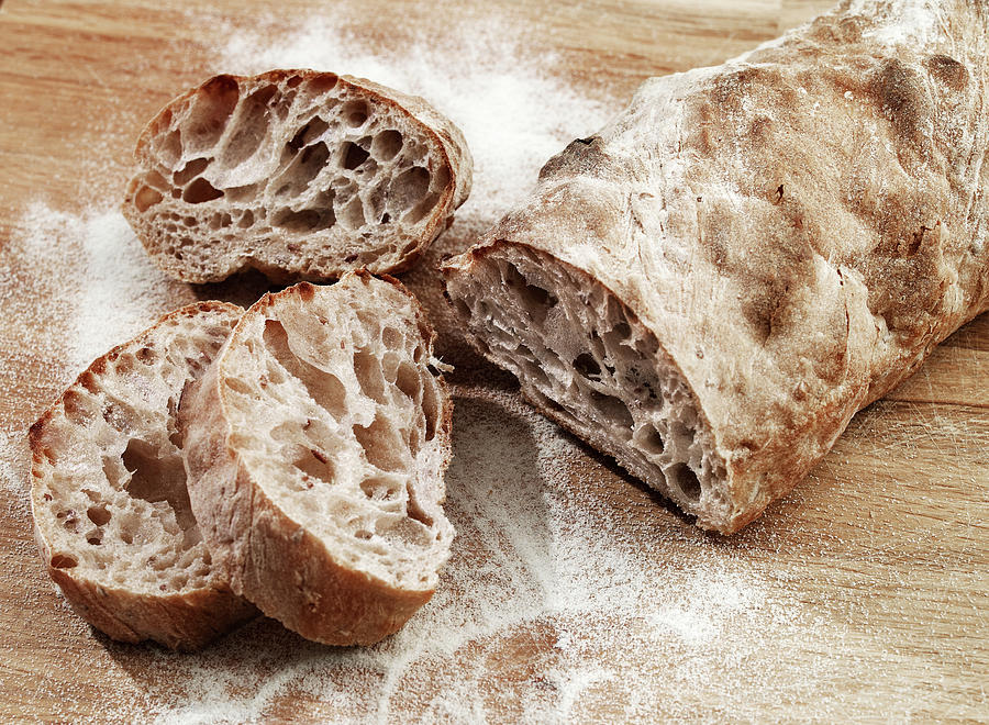 Bread On Woodboard Photograph by Kristianseptimiuskrogh