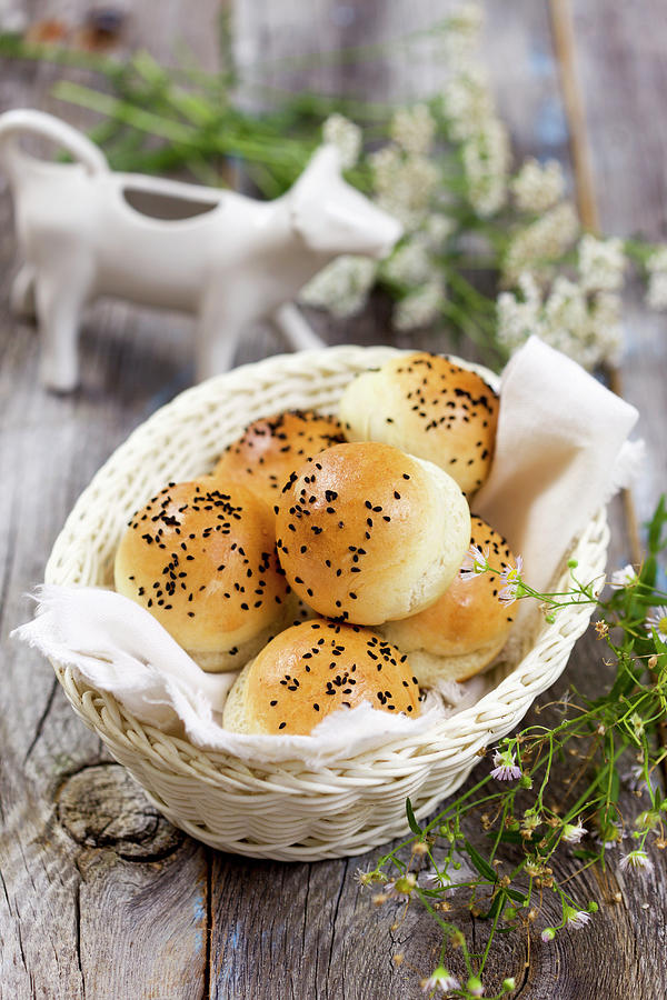 Bread Rolls With Black Sesame Seeds In A Bread Basket Photograph by Boguslaw Bialy