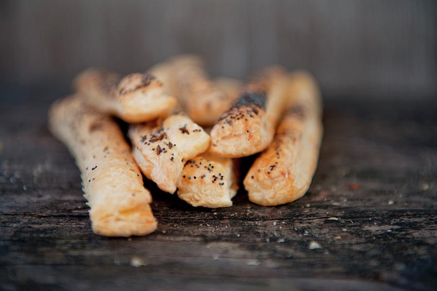 Bread Sticks With Poppy Seeds On A Wooden Table Photograph by Gabriela Lupu
