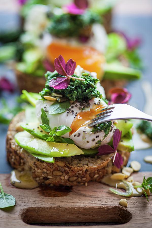 Bread Topped With Avocado, A Poached Egg, And Green Cabbage Tapenade superfood Photograph by Eising Studio