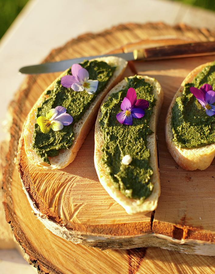 Bread With Sorrel Pesto And Violets Photograph by Hannah Kompanik