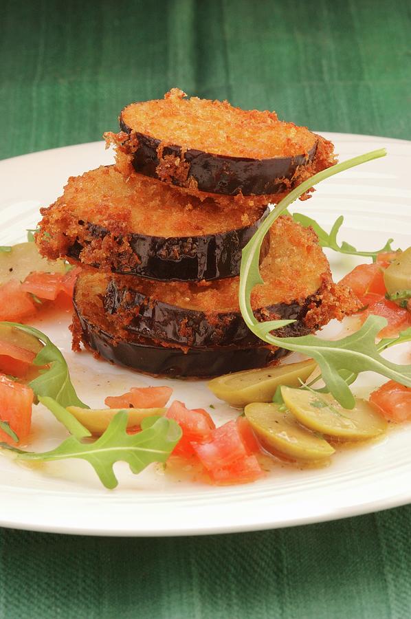 Breaded Aubergines With Olives And Tomatoes Photograph by John Hay
