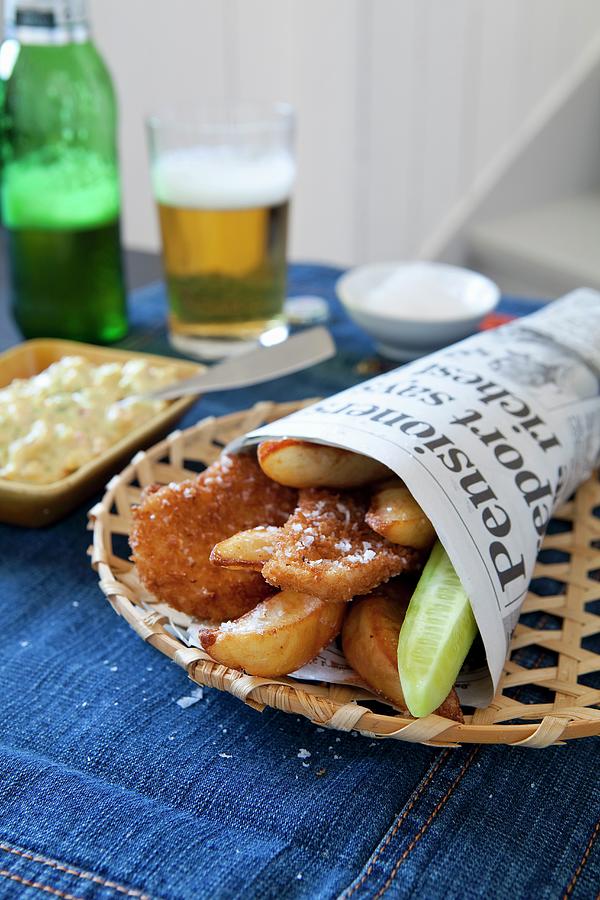 Breaded Chicken Strips With French Fries In Newspaper Bag Photograph by Mans Jensen