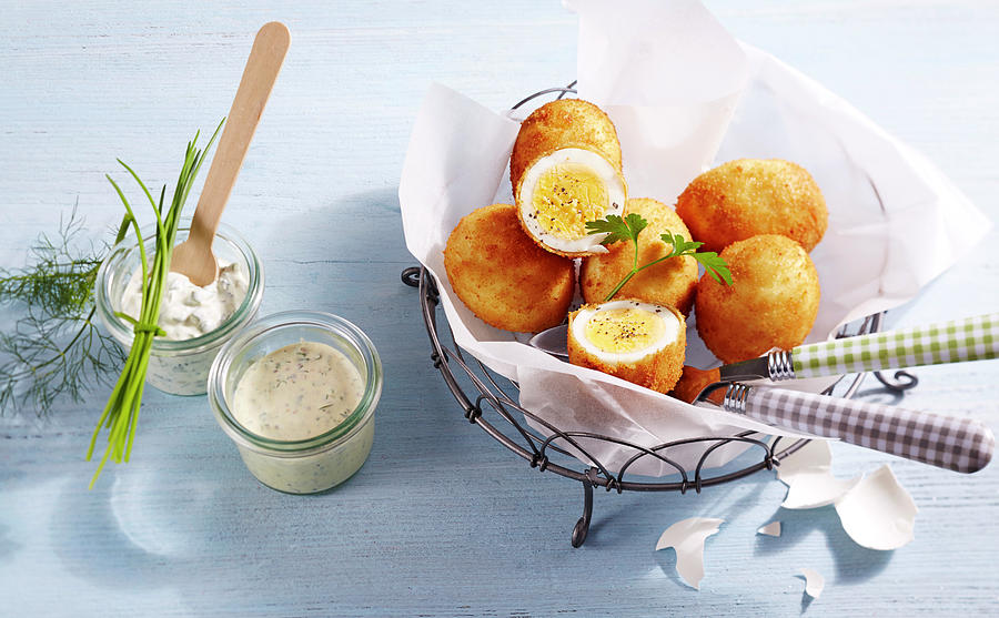 Breaded Eggs In Parchment Paper In A Metal Basket Next To A Mustard Dip And Remoulade Photograph by Teubner Foodfoto