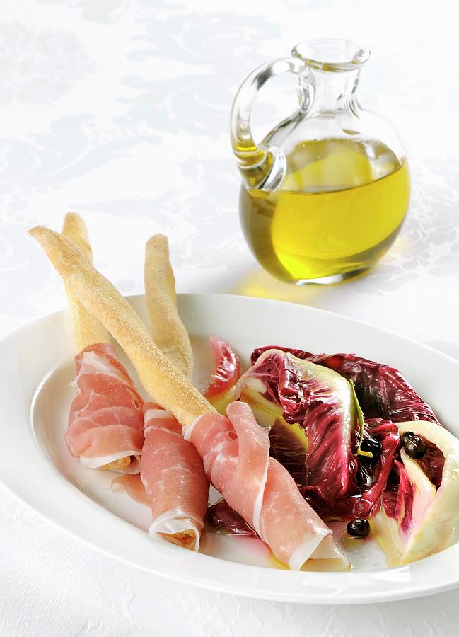 Breadsticks With San Daniele Ham And A Radicchio Salad Photograph by Franco Pizzochero