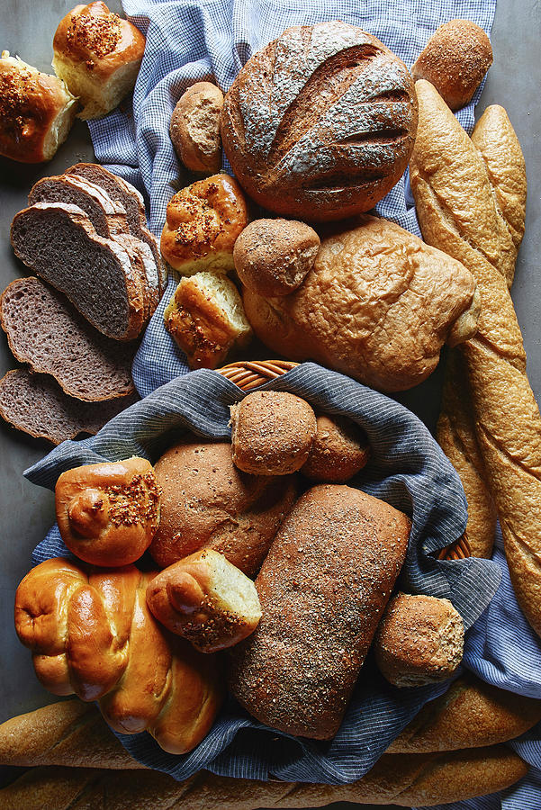 Breakfast Breads And Pastries In A Bread Basket And On A Cloth Photograph by Fred + Elliott  Photography