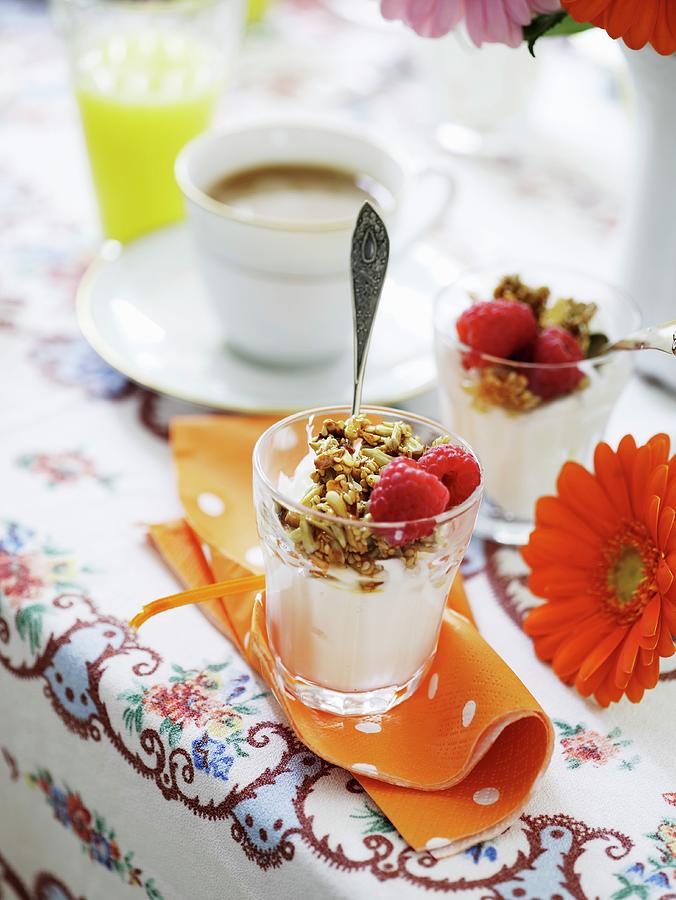 Breakfast Muesli On Yoghurt Served With Coffee And Juice Photograph by Mikkel Adsbl