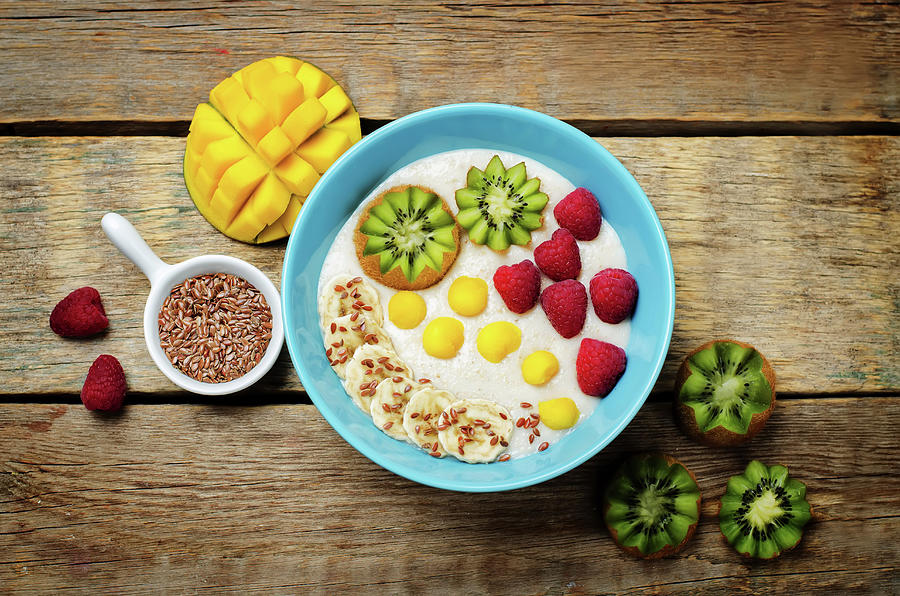 Breakfast Oatmeal Porridge With Kiwi, Mango, Raspberry, Banana And Flax Seeds Photograph by Natasha Arz