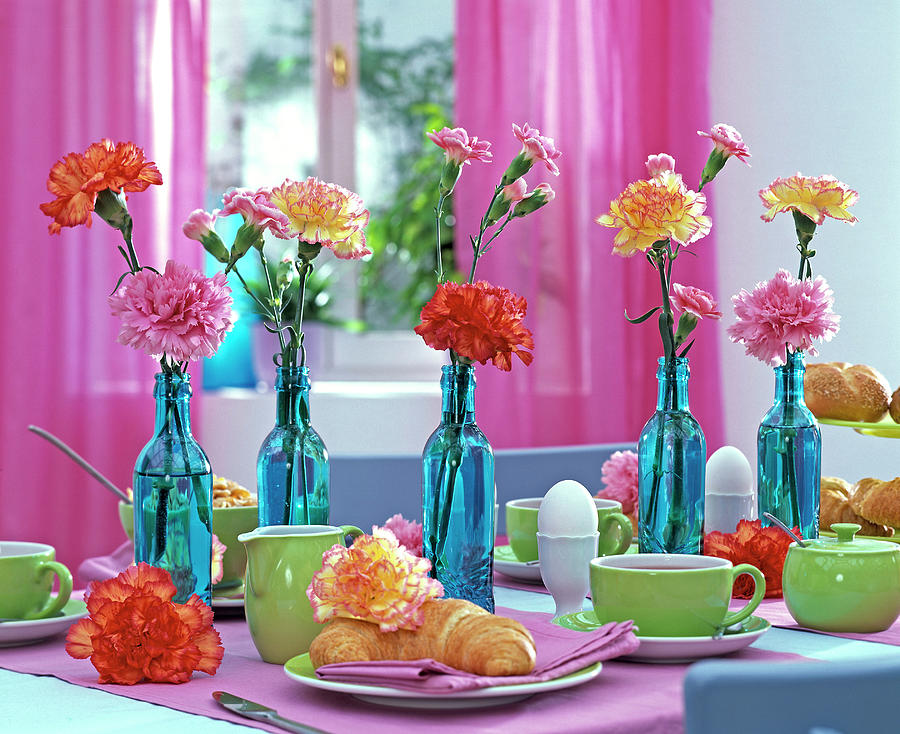 Breakfast Table With Dianthus carnation In Blue Bottles Photograph by Friedrich Strauss