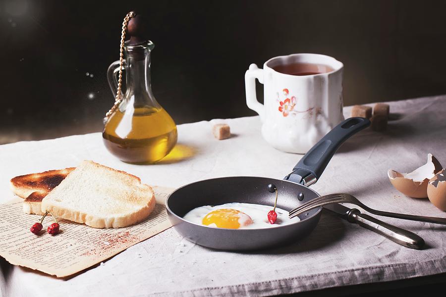Breakfast With A Fried Egg, Toast, Chilli Peppers And Olive Oil Photograph by Natasha Breen