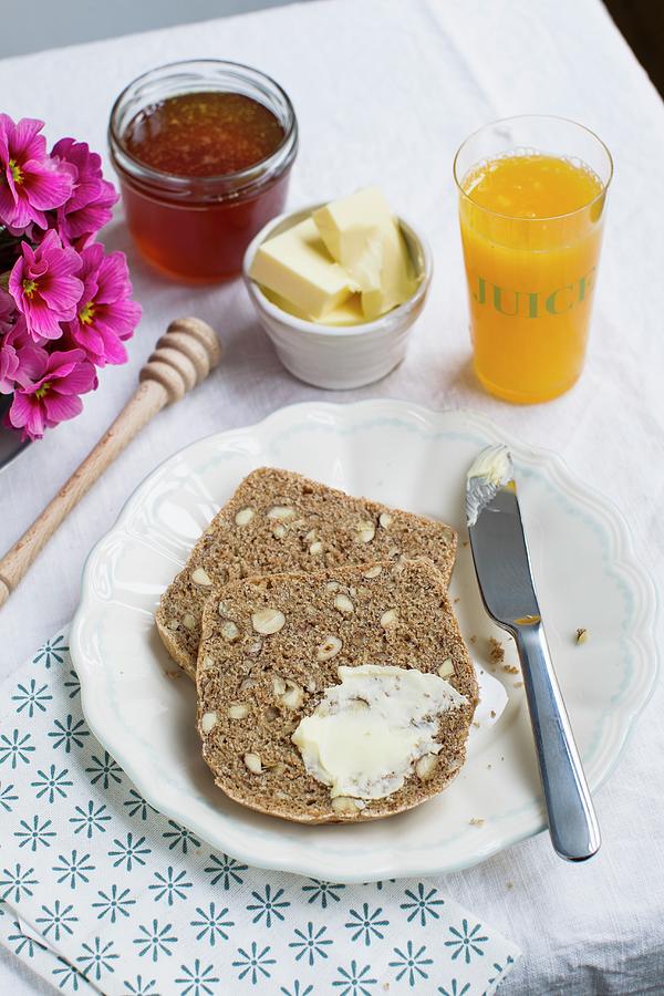 Breakfast With Nutty Wholemeal Bread, Honey And Orange Juice Photograph by Sporrer/skowronek
