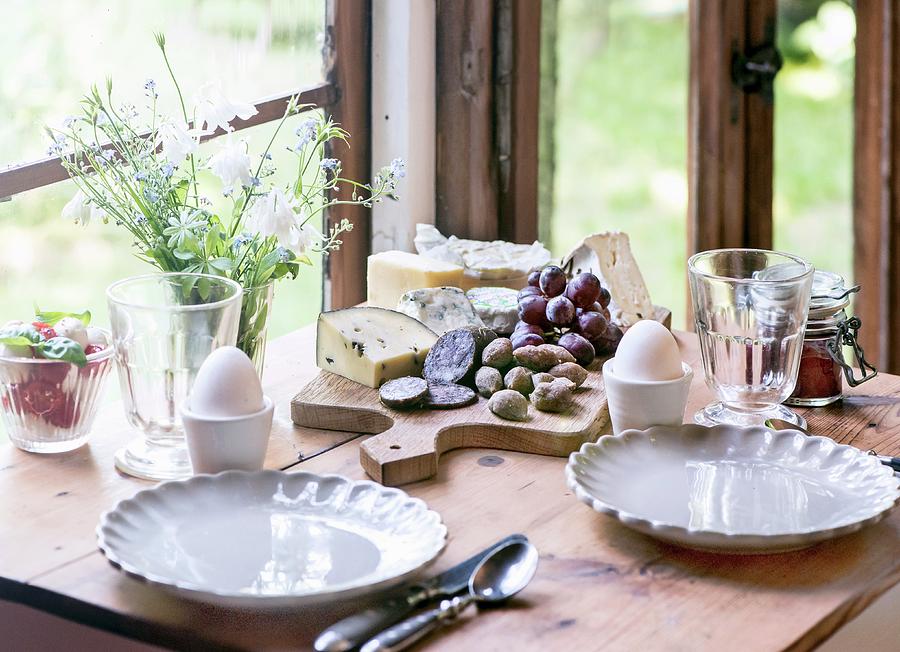 Breakfast With Soft-boiled Eggs, Grapes, Jam, Salami, Cheese And Caprese Salad Photograph by Fotografie-lucie-eisenmann