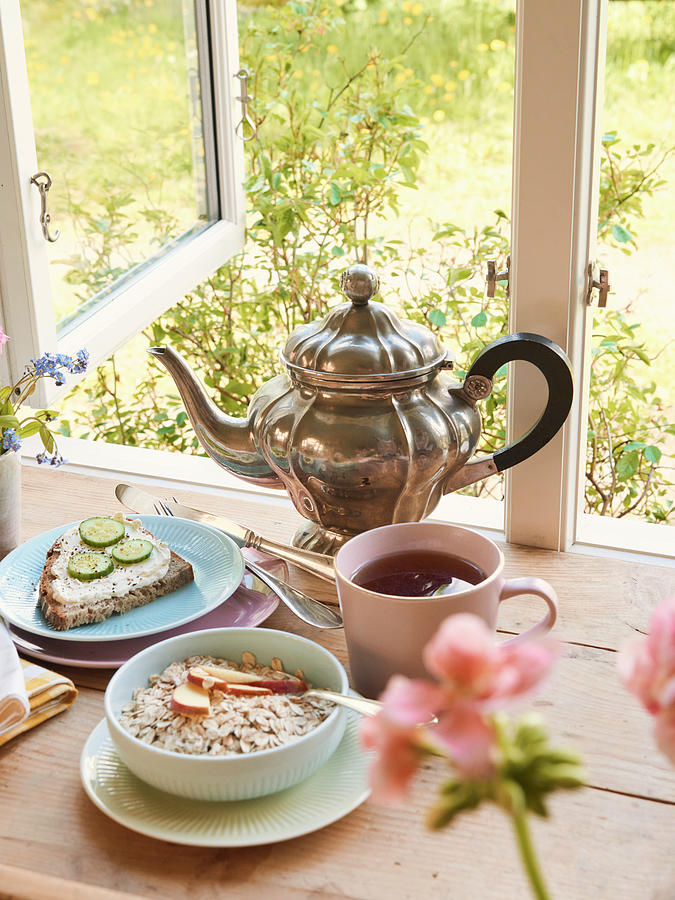 Breakfast With Tea, Porridge And Bread By An Open Window Photograph by Hannah Kompanik