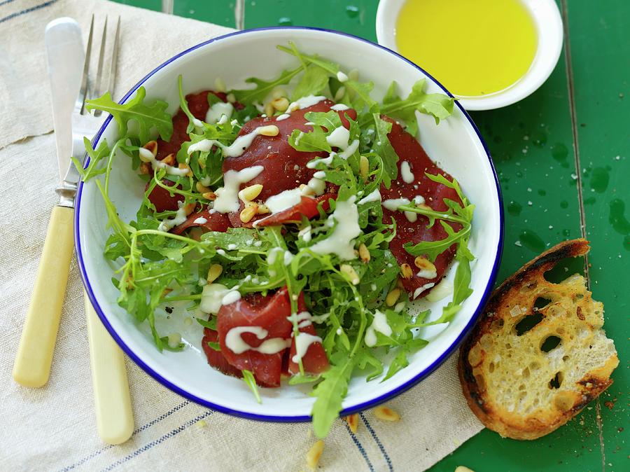 Bresaola With Rocket And Pine Nuts Photograph by Lina Eriksson