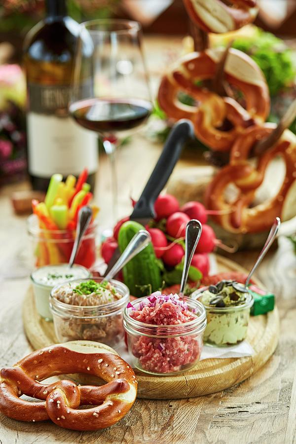 Brettljause bavarian Ploughmans Lunch With Pretzels, Dips, Vegetables And Red Wine Photograph by Herbert Lehmann
