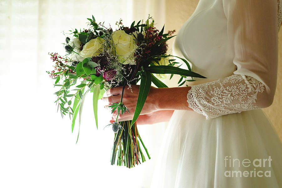 Bride holding her wedding bouquet Photograph by Joaquin Corbalan
