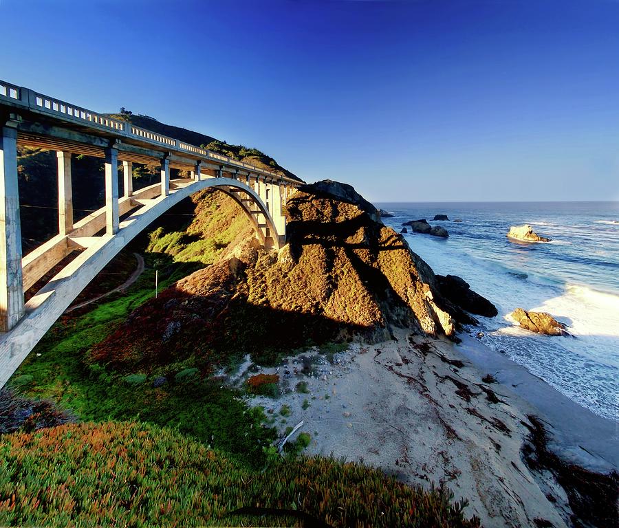 Bridge Spanning A Valley Next To The Sea Photograph by Christopher Chan