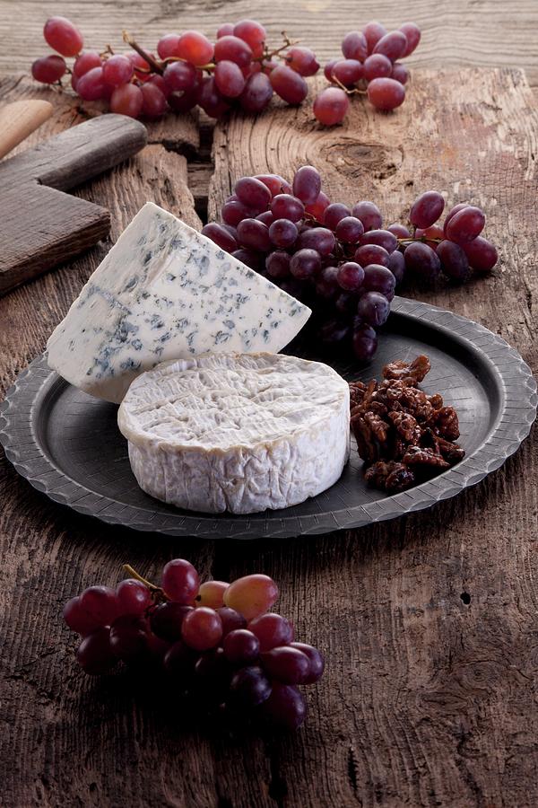 Brie And Blue Cheese With Grapes And Caramelised Nuts Photograph by Wawrzyniak.asia