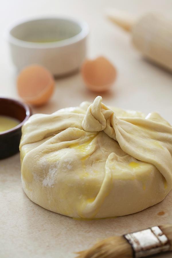 Brie Wrapped In Pastry Dough Ready For Baking Photograph By Yelena