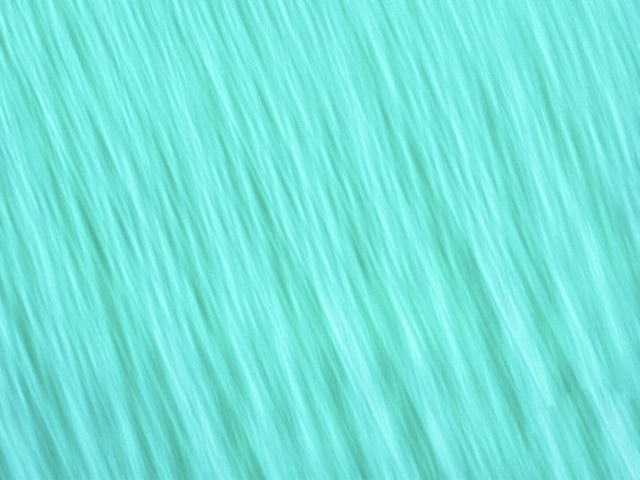Bright turquoise blue blurred diagonal lines abstract  Photograph by Teri Virbickis