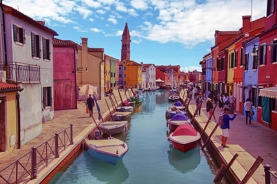 Brightly painted houses and small boats in canal Photograph by Steve Estvanik