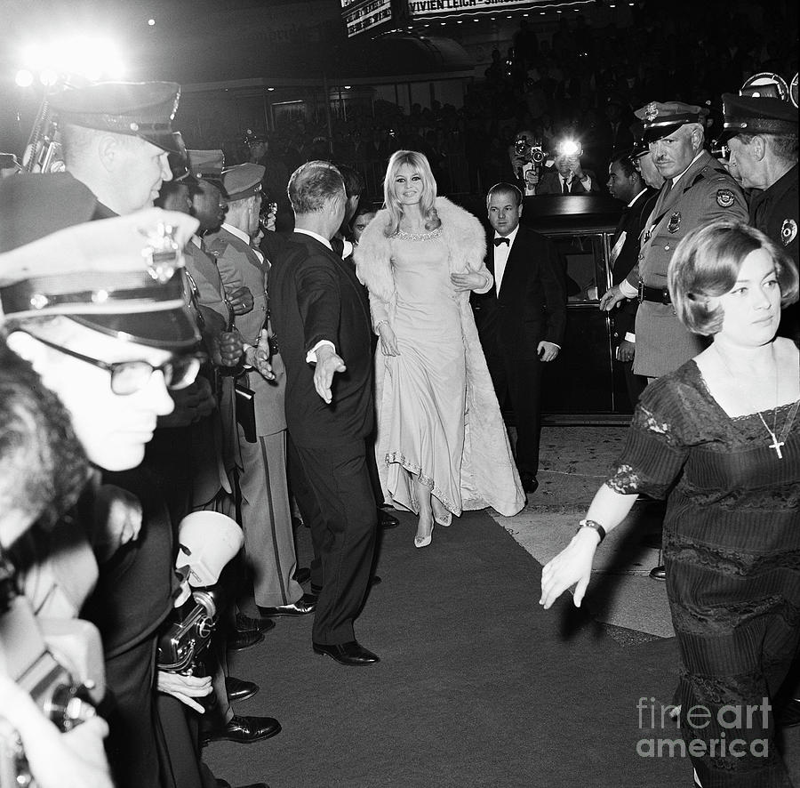 Brigitte Bardot Lifting Dress Hem Photograph by Bettmann