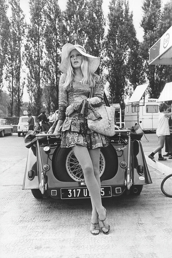 Black And White Photograph - Brigitte Bardot Posed With Vintage Car by Giancarlo Botti