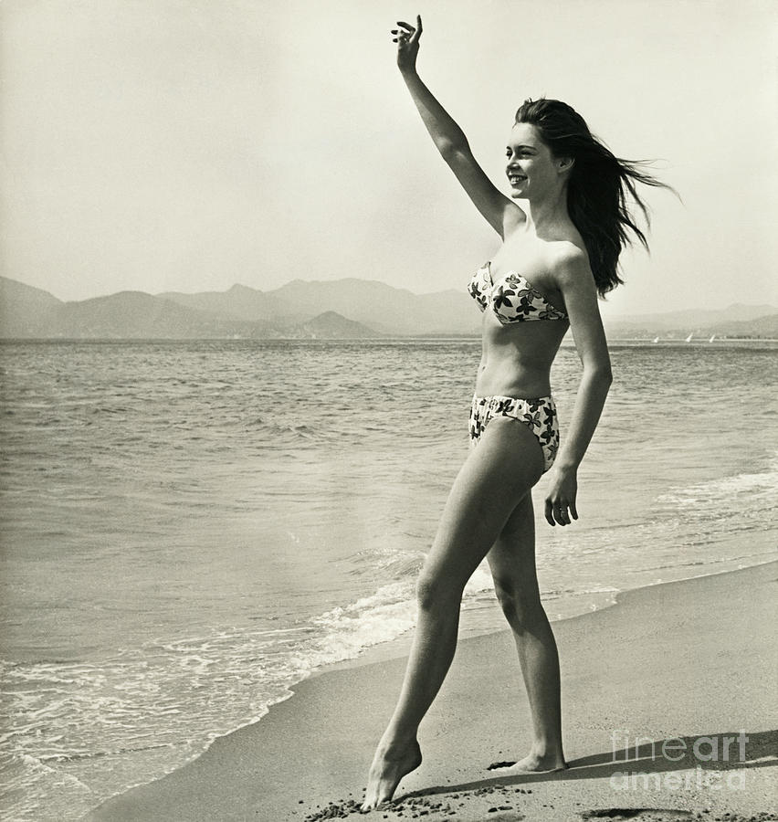 Brigitte Bardot Waving On The Beach Photograph by Bettmann