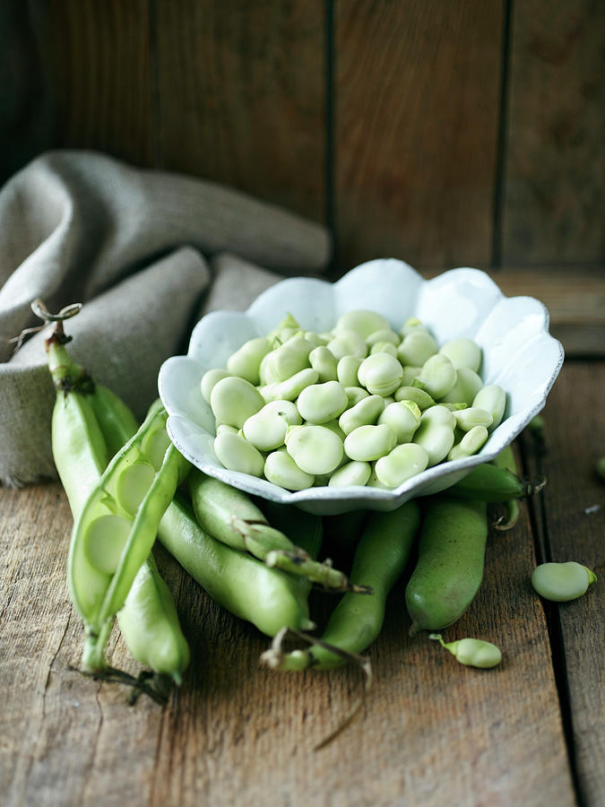 Broad Beans In Pods And In A Bowl Photograph by Oliver Brachat
