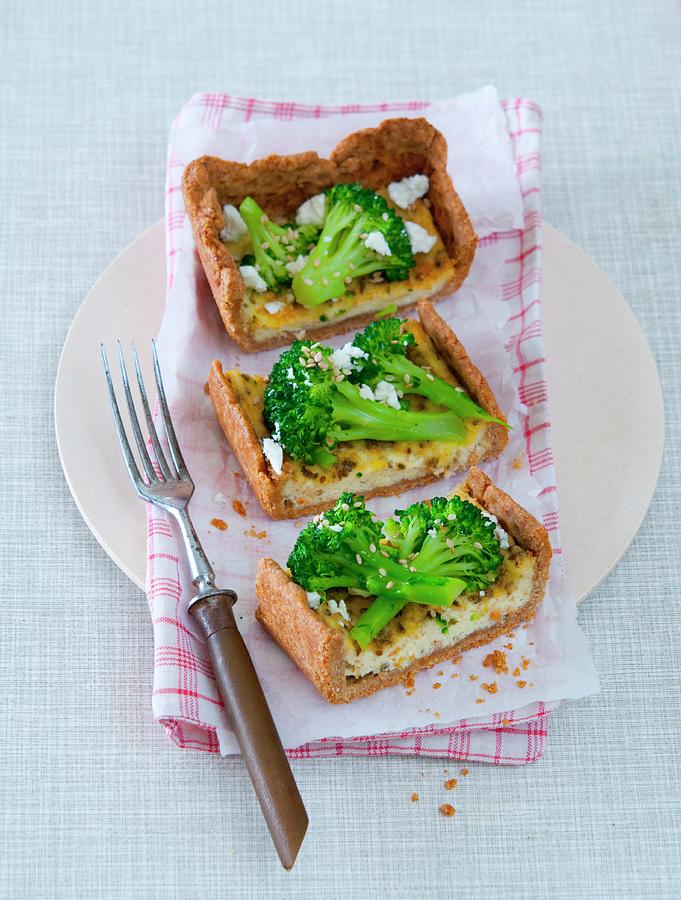 Broccoli And Sheeps Cheese Quiche Cut Into Slices Photograph by Udo Einenkel