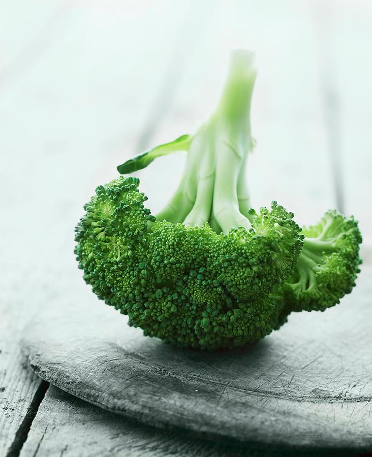 Broccoli On A Wooden Plate Photograph by Mikkel Adsbl