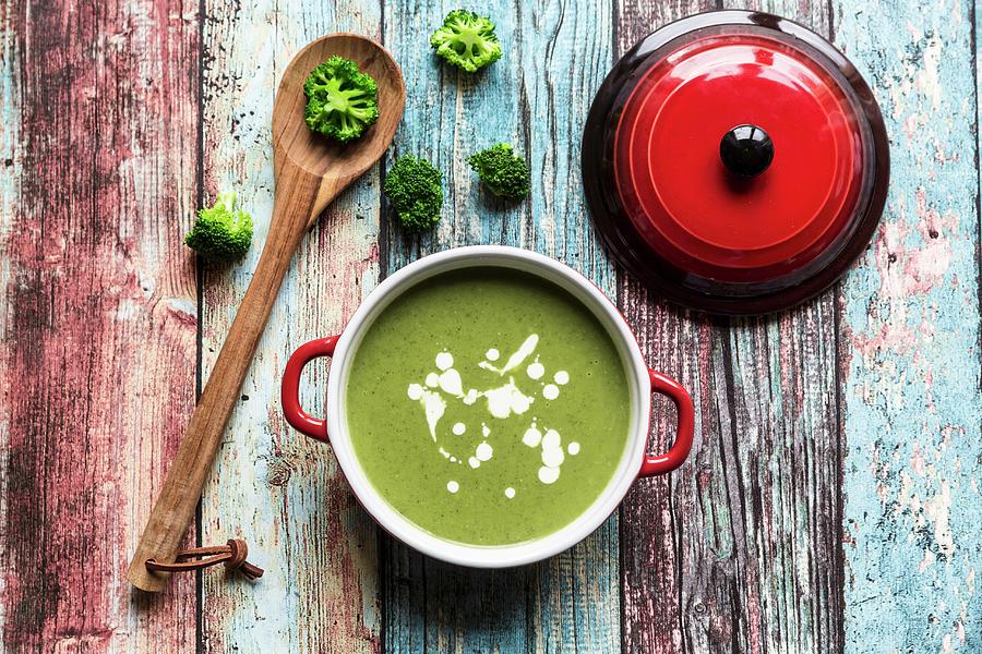 Broccoli Soup, Broccoli Florets And A Cooking Spoon Photograph by Sandra Rsch