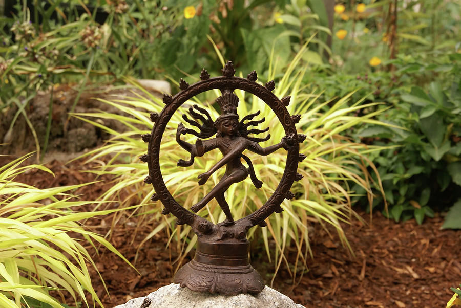 Bronze Shiva in garden Photograph by Steve Estvanik